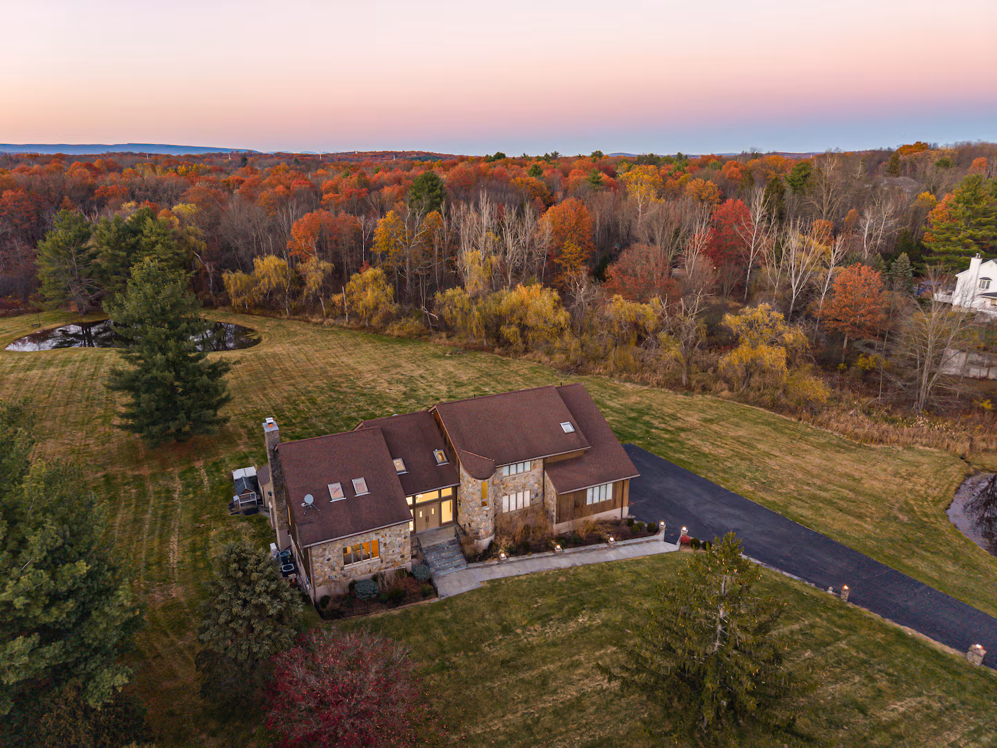 Misty Hudson Valley mountains in peak autumn foliage at golden hour